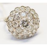 A diamond three tier round cluster 18ct white gold ring,