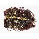 A collection of garnet jewellery to include faceted and chip bead strands,