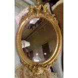 ****Ex Luddington Manor****A 19th Century oval gilt wood and gesso framed wall mirror,