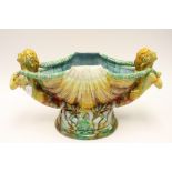 A Majolica jardiniere in the form of a shell with two mermaids supporting it (1)