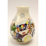 A Moorcroft vase in the Nut Cracker pattern, the vase standing approx 19.