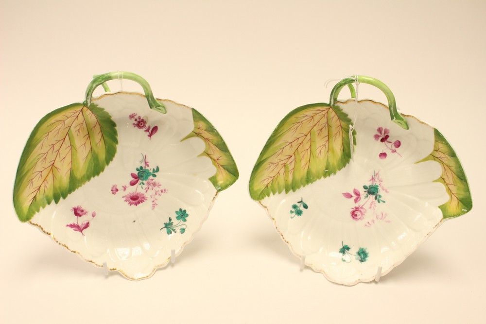 ****Ex Luddington Manor****A pair of Chelsea style leaf moulded china dishes, with twig handles,