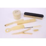 A collection of faux ivory to include shoe horn, glove stretchers,