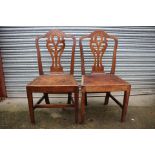 A pair of George III camel back elm side chairs, pierced splats, solid seats, circa 1800,