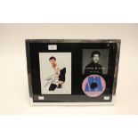 A signed, framed and glazed photograph of Lionel Ritchie,