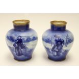 A pair of Doulton baluster vases,