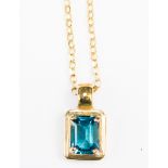 A blue topaz and 9ct gold pendant,