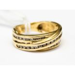 A diamond set 14ct gold band ring, with the illusion of three crossing bands ,