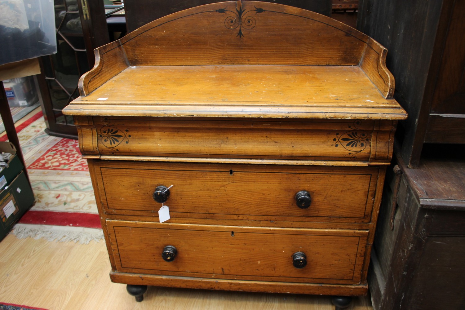 A pine painted chest of drawers with frieze drawer,