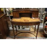 An Edwardian style mahogany writing desk, with a leathered writing surface,