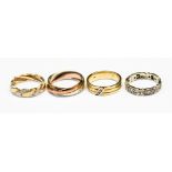 Four 9ct rings, with various designs,