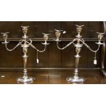 Two large silver plate on copper candelabrum,