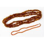 An amber necklace of rough irregular bends, approx 160cms long,