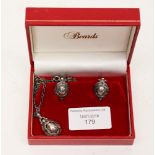 A Georg Jenson 1997 silver pendant and earring set of oval form, stylised fruit and leaves,