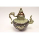 A copper and silver Egyptian kettle