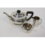 A matched three piece silver tea service, sugar bowl, London 1910, approx 80gms/2.