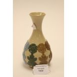 A Doulton stoneware factory sample vase, applied flowers each in a different glaze colour,