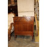 A 20th Century mahogany sewing table, together with an early 20th Century piano stool,