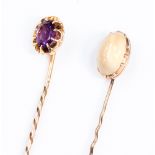 A Moonstone stick pin, set in rose metal,