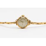 A 9ct gold ring cased Hirco watch, a 9ct gold strap, gross weight approx 15.