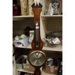 A Josh Testi and Co wheel barometer, incorporating thermometer, the case being oak,