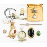 A collection of costume jewellery and items to include a paste brooch, a green stone pendant,