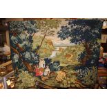 A large wall hanging tapestry on a turned wood pole,