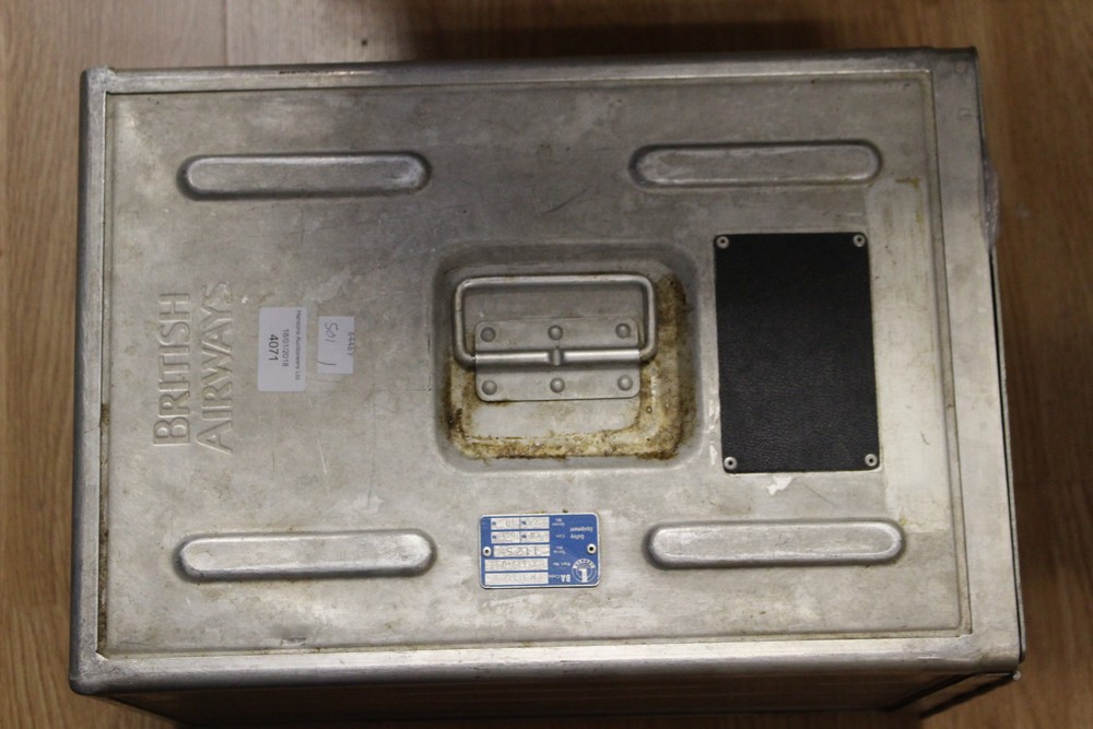 British Airways metal food container containing various items of memorabilia from Concorde.