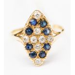 A diamond and sapphire ring, with a marquise shaped setting,