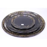 ****Ex Luddington Manor****A graduated set of three oval gilt painted papier mache trays