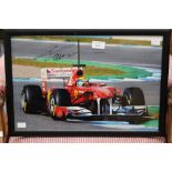 Formula 1 Memorabilia: A framed and signed Felipe Massa action photograph, signature to upper left,