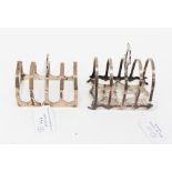 Two silver toast racks,