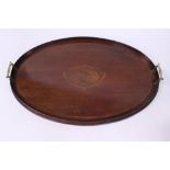 An oval two handled mahogany tray