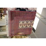 A Turkish style woven wool rug deep reds/navy