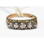 A five stone diamond boat ring, of graduated old-cut diamonds and rose-cut diamond chips,