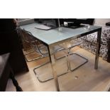 ****Ex Luddington Manor****A rectangular glass topped and framed dining table,