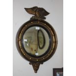 A Regency style convex mirror,