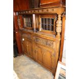 A Jacobean style oak sideboard, in the form of a 17th Century court cupboard,