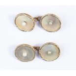 A pair of 9ct gold chain cufflinks, set with mother of pearl with a seed pearl centre,