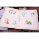 A Victorian scrap book with early postcards