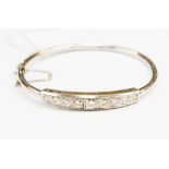 A diamond and 14ct white gold bangle, with a total diamond weight of approx 2.