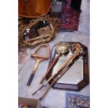 An oak framed mirror; together with a gilt framed mirror, a small brass warming pan,