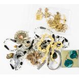 A collection of costume jewellery comprising gold fronted Victorian clips, bone bead necklace,