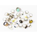 A collection of dress twenty four rings, comprising twenty two silver rings, some set with c z,