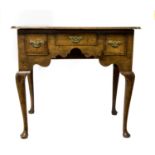 ****Ex Luddington Manor****An 18th Century oak three drawer lowboy, the front with a shaped apron,