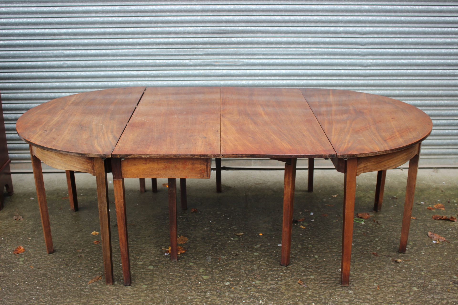 A George III mahogany dining table, circa 1790,