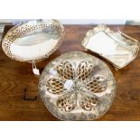 An Edwardian plated grape tazza and two plated handle baskets (3