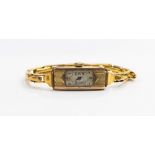 An Art Deco 9ct gold cased ladies watch, a 9ct gold strap, approx 15.