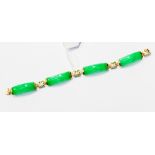 A dyed jade bracelet set in 14ct gold, with gold and jade spacer details, length approx 6.5'', 13.