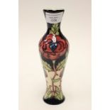 A Moorcroft Trial vase, pink and blue rose flowers on cream and black ground, 1st quality vase,